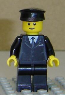 Suit Black, Black Police Hat, Male Thin Grin, Brown Eyebrows, Thin Grin