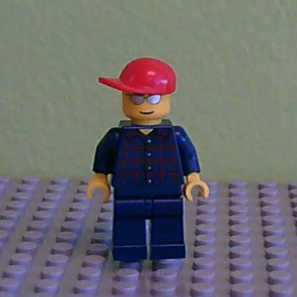 Plaid Button Shirt, Dark Blue Legs, Red Short Bill Cap, Silver Sunglasses