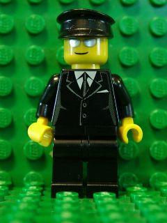 Suit Black, Black Hat, Silver Sunglasses - Airport Limo Driver