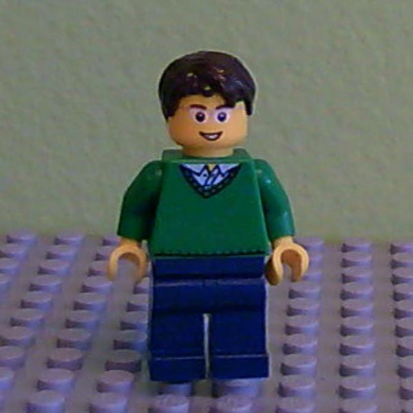 Green V-Neck Sweater, Dark Blue Legs, Dark Brown Short Tousled Hair, Glasses