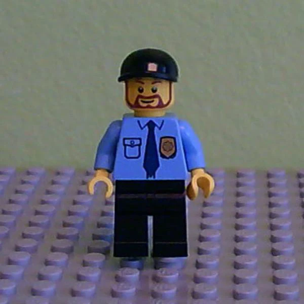Police - City Shirt with Dark Blue Tie and Gold Badge, Black Legs, Black Short Bill Cap, Brown Beard Rounded