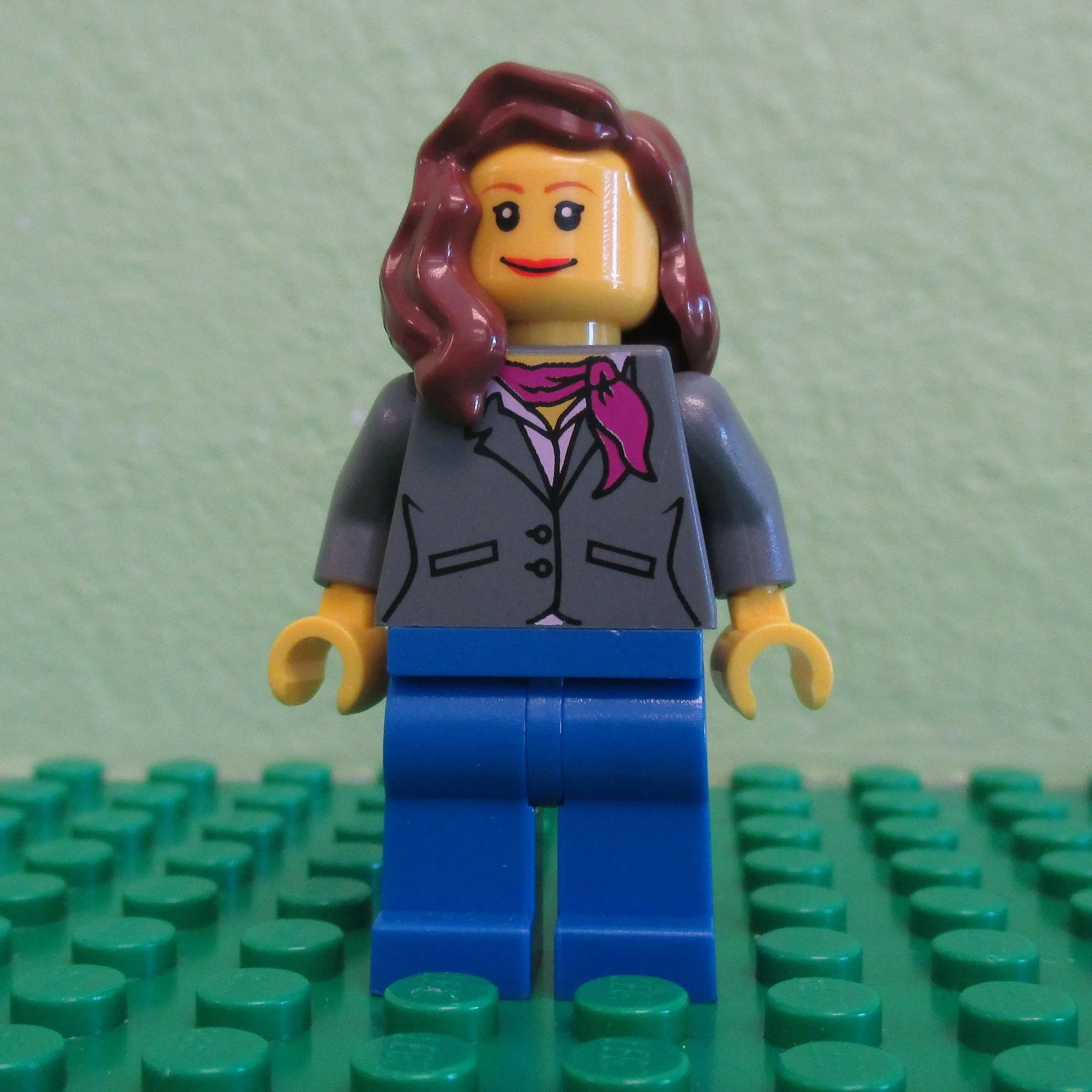 Dark Bluish Gray Jacket with Magenta Scarf, Blue Legs, Reddish Brown Female Hair over Shoulder