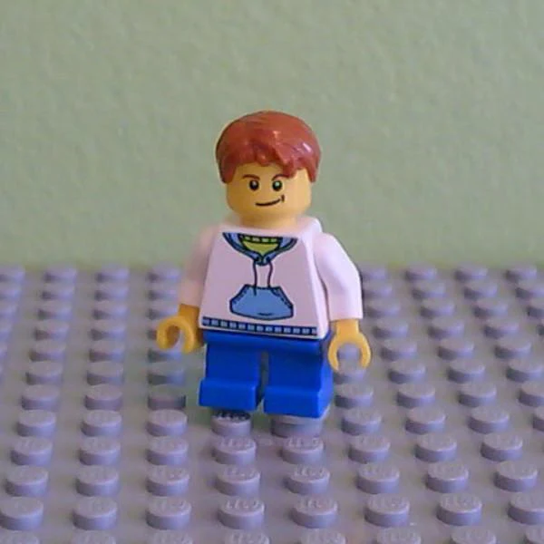 White Hoodie with Blue Pockets, Blue Short Legs, Dark Orange Hair, Crooked Smile with Black Dimple